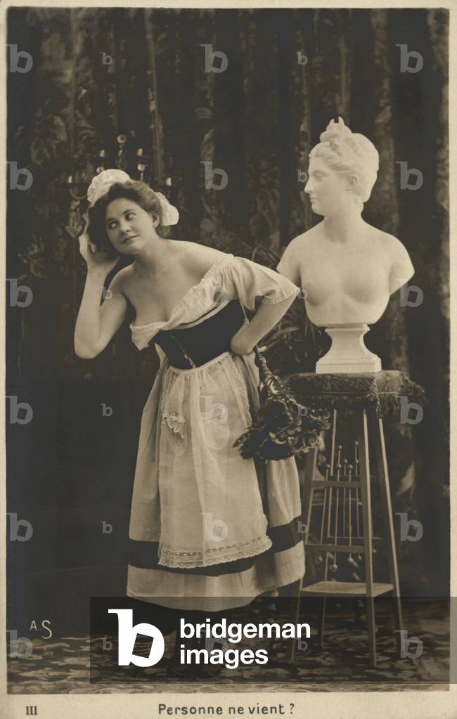 French maid dusting a bust (b/w photo)