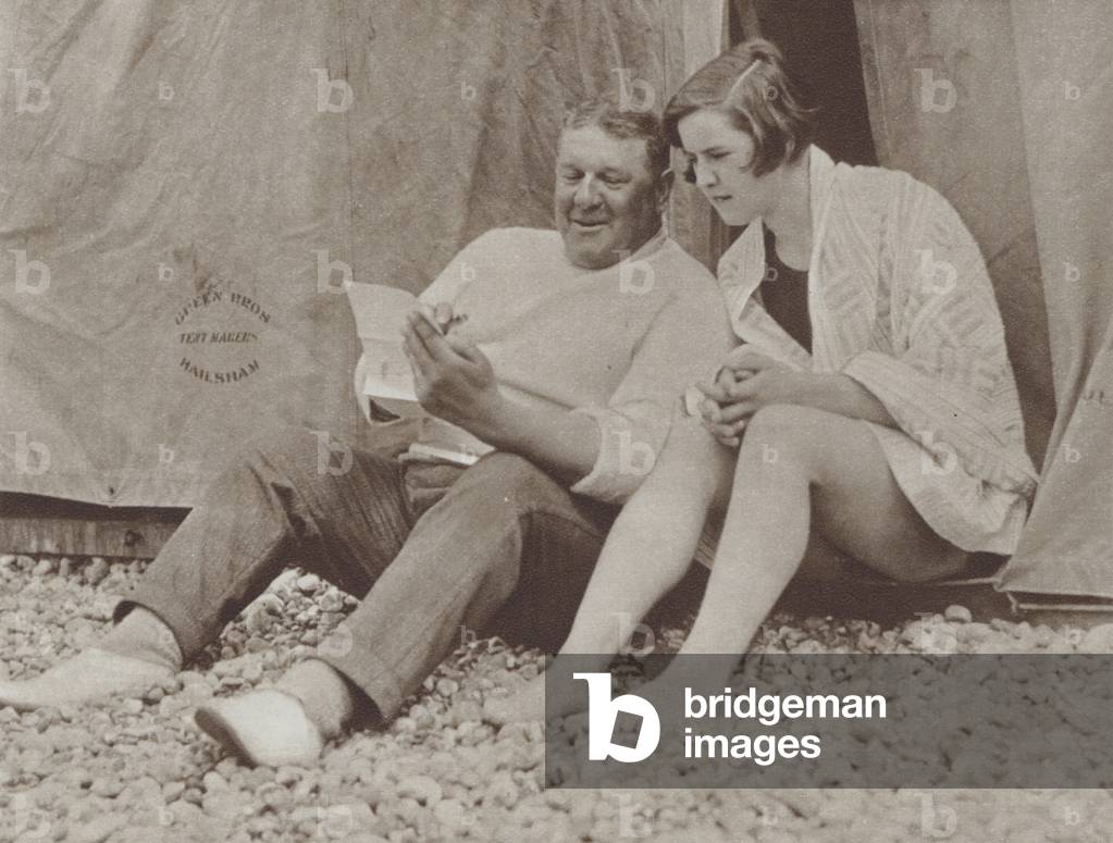 American swimmer Gertrude Ederle, the first woman to successfully swim the English Channel, receiving advice from her trainer, Jabez Wolff, 1926 (b/w photo)