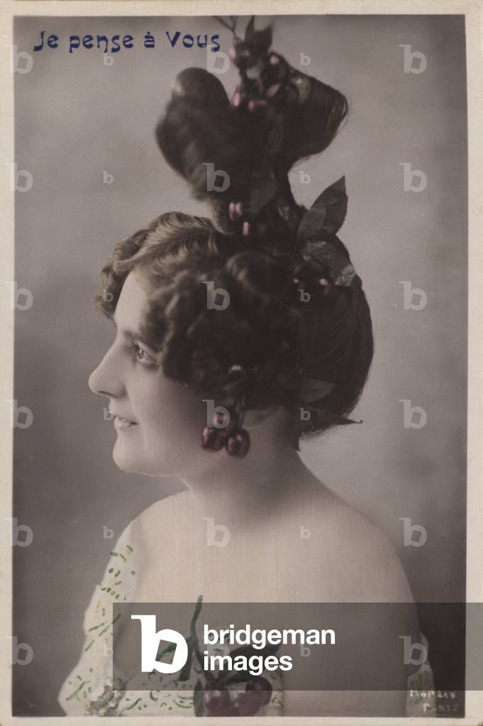Woman with elaborate hairstyle with cherries (colour photo)