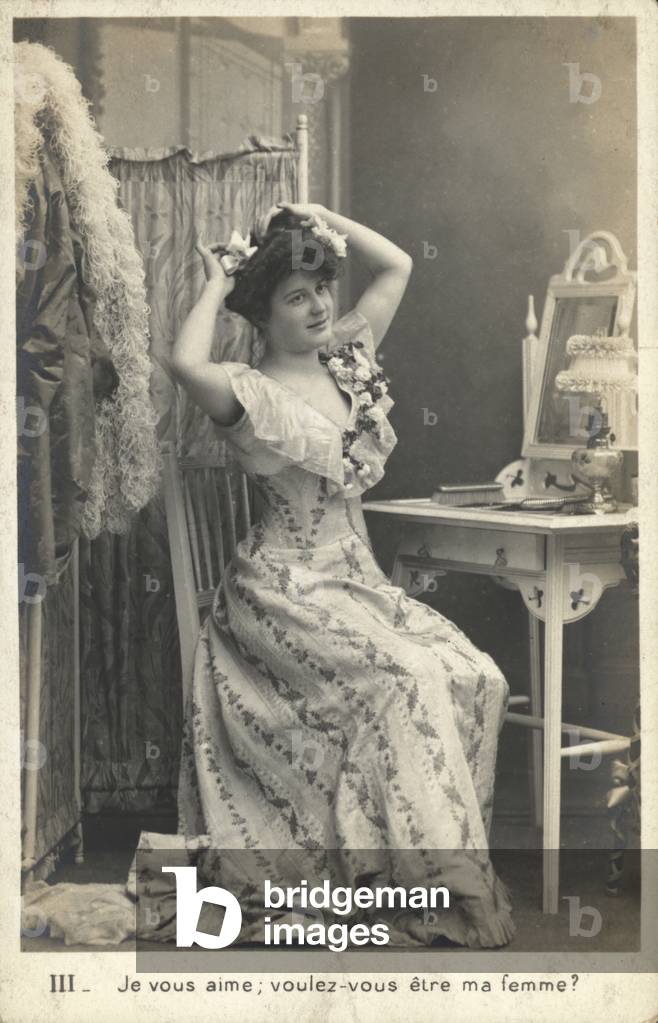 Woman at a dressing table (b/w photo)