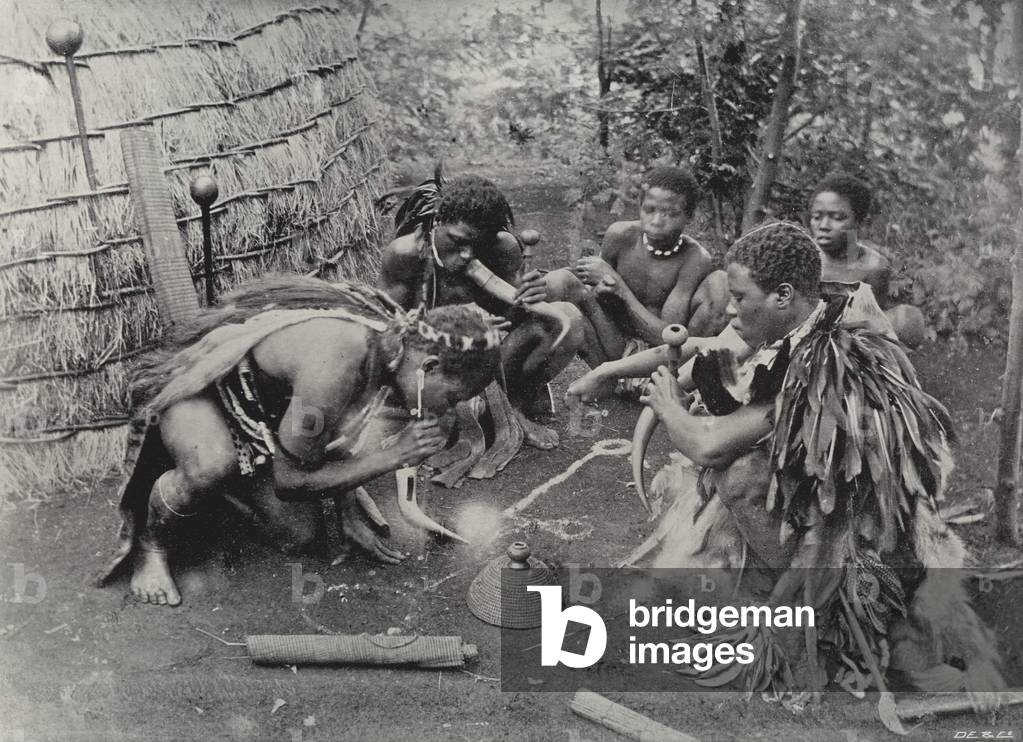 A Smoking Party, Zululand (b/w photo)