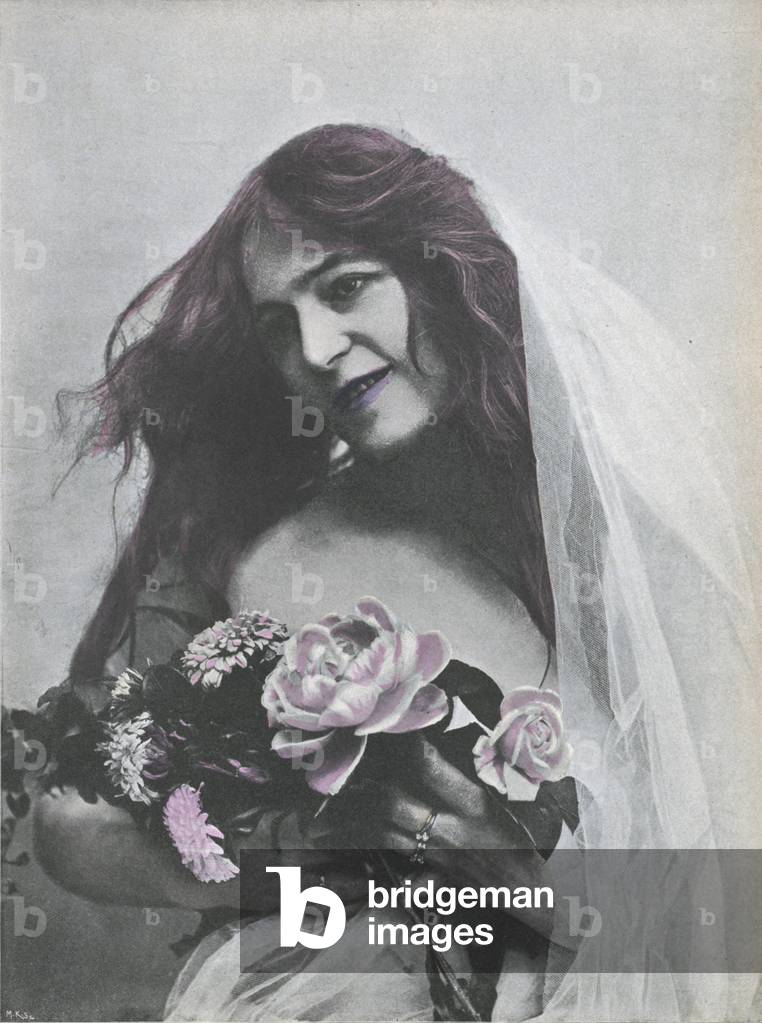 Portrait of a woman holding a bouquet of flowers (coloured photo)