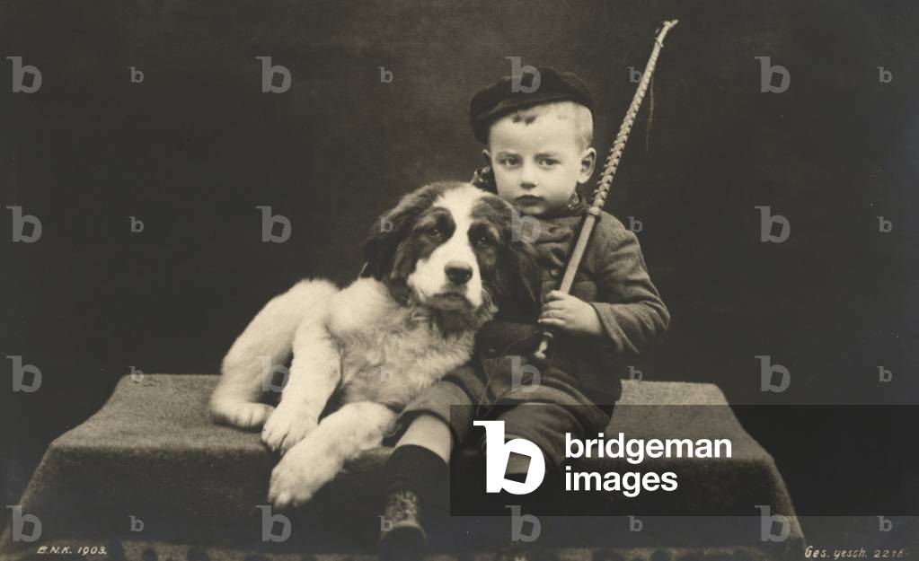 Little boy with dog (b/w photo)