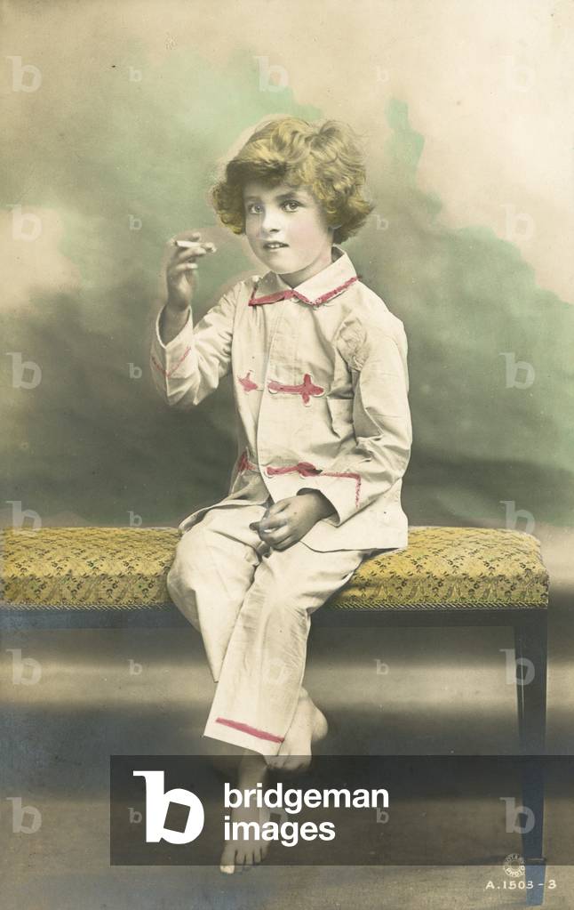 Child, wearing pyjamas, smoking (colour photo)