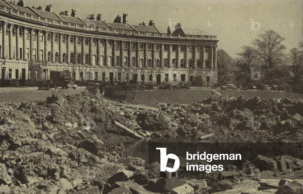 Crater in front of the Royal Crescent, Bath, made by a German bomb dropped during the Baedecker Blitz, World War II, April 1942 (b/w photo)
