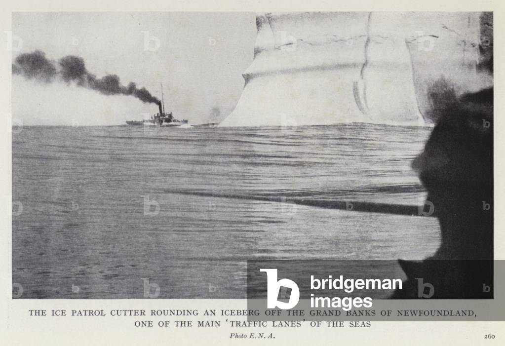The ice patrol cutter rounding an iceberg off the grand banks of Newfoundland, one of the main 'traffic lanes' of the seas (b/w photo)