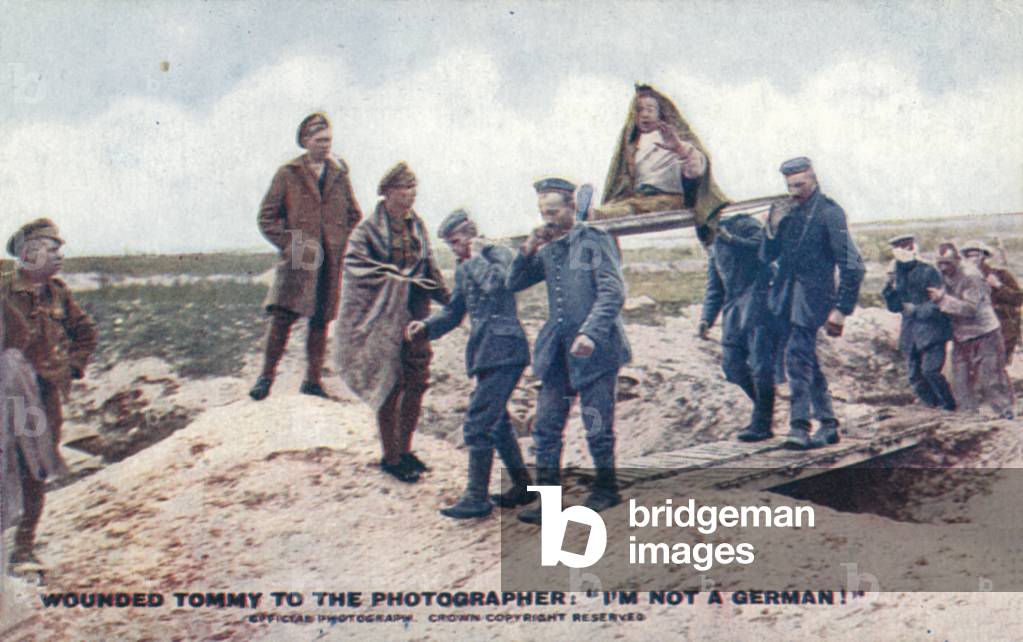 Wounded soldier carried on a stretcher (colour photo)