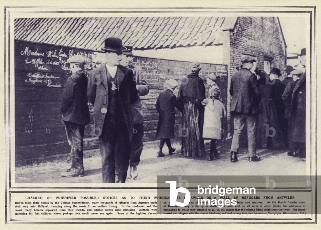 Chalked up wherever possible, notices as to their whereabouts scrawled on a wall by refugees from Antwerp (b/w photo)