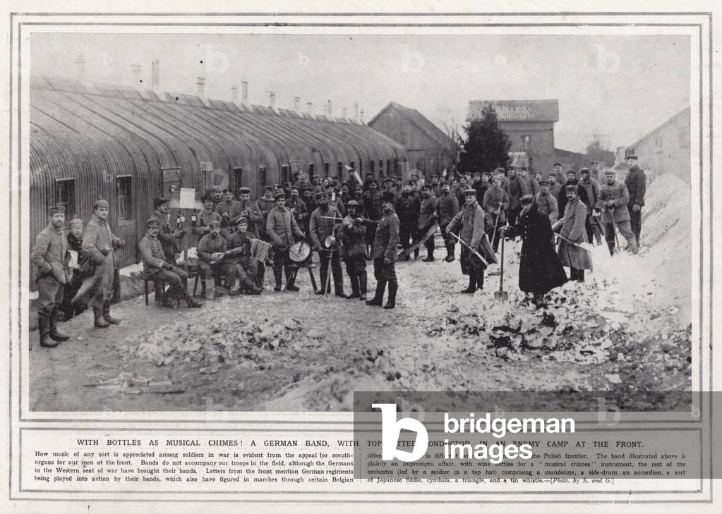 With bottles as musical chimes! A German band, with top-hatted conductor, in an enemy camp at the front (b/w photo)