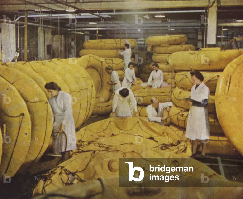 British women factory workers manufacturing self-inflating rubber dinghies, World War II, 1939-1945 (photo)