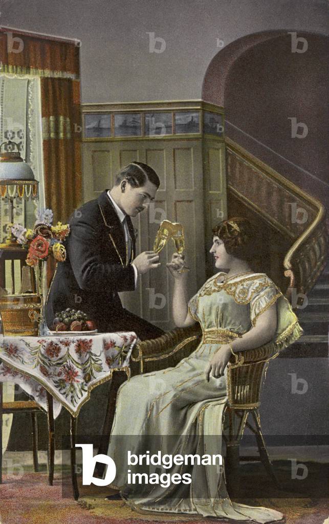A couple toasting each other's wine glasses (photo)