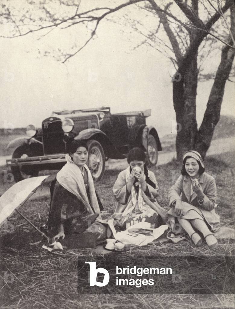 Japanese women at a picnic wearing western clothes (b/w photo)