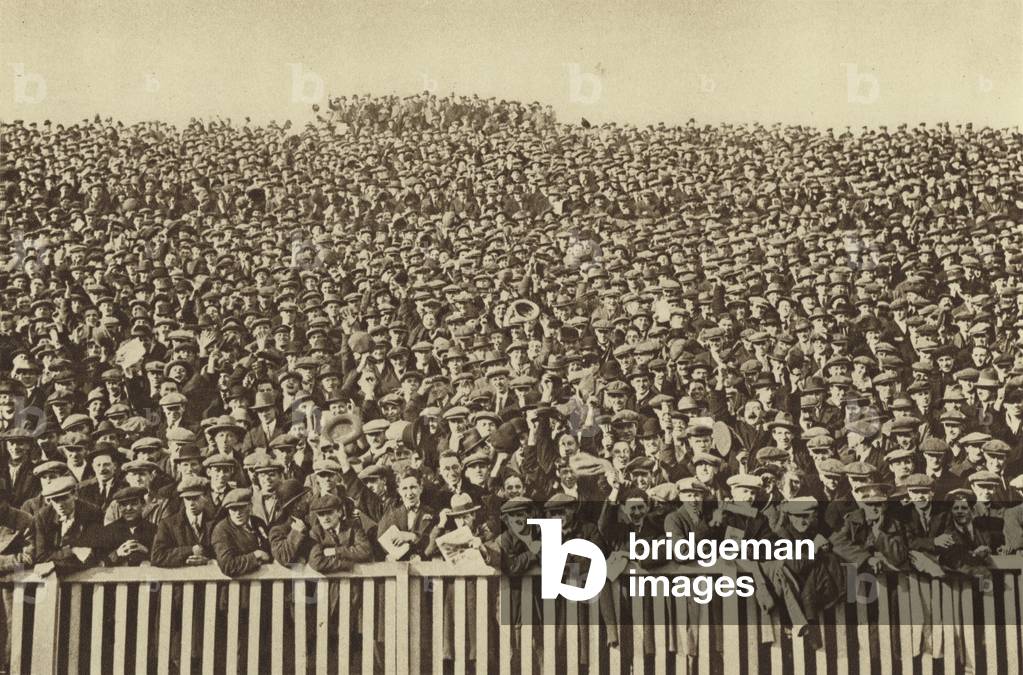 The many-headed voice which roars behind the touch-line every winter Saturday (b/w photo)