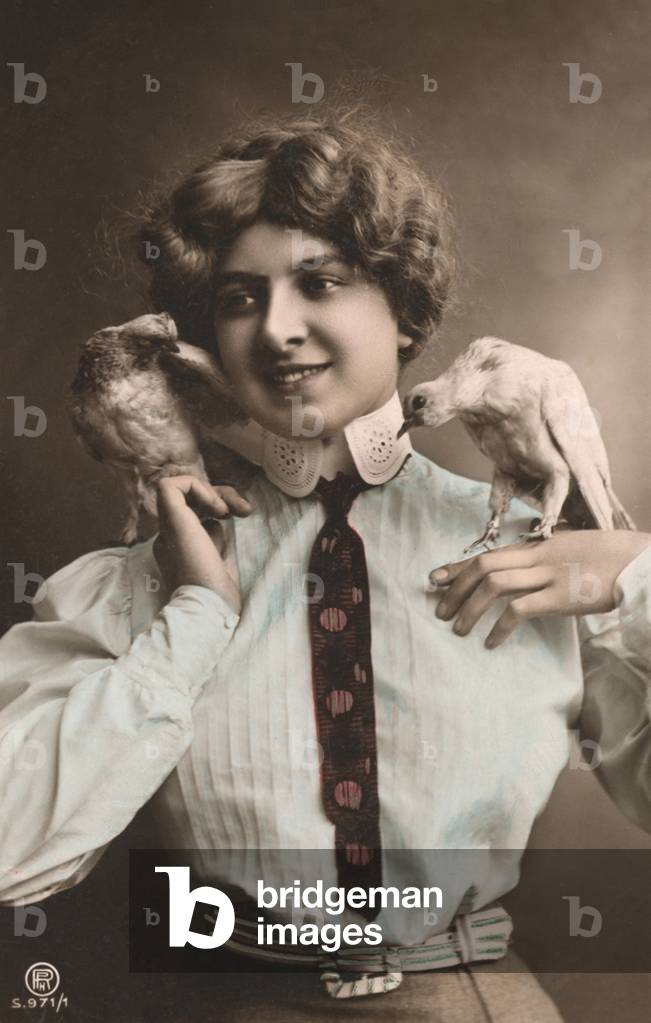 Girl with a tie holding two birds, 1900s (postcard)