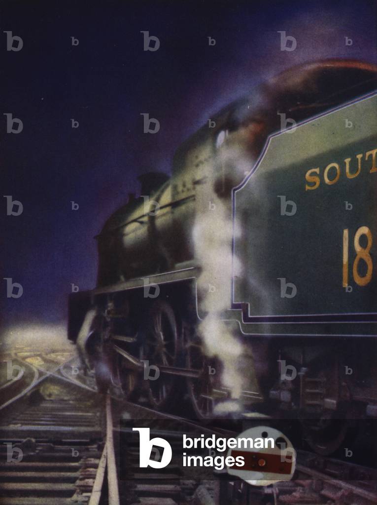 Southern Railway 2-6-0 Mogul steam locomotive hauling a night train (colour litho)