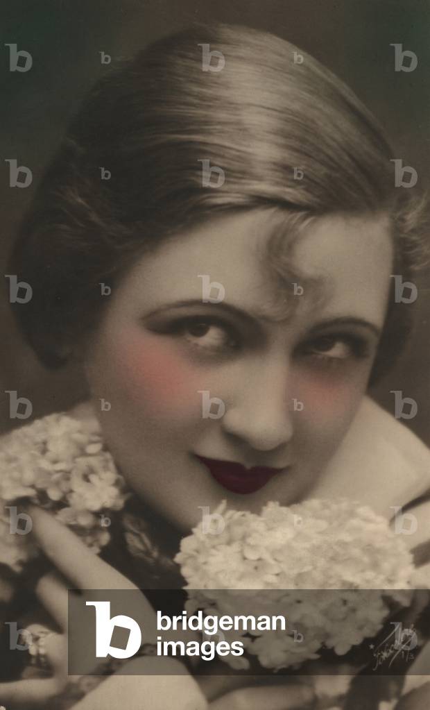 Woman with a curl on her forehead (colour photo)