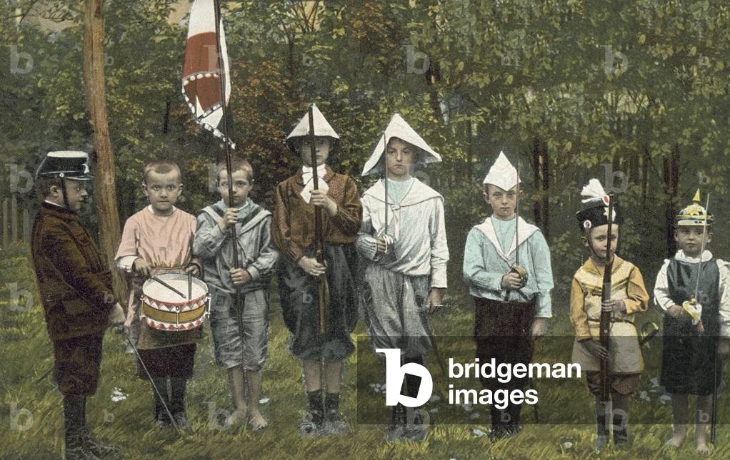Group of boys playing soldiers (photo)