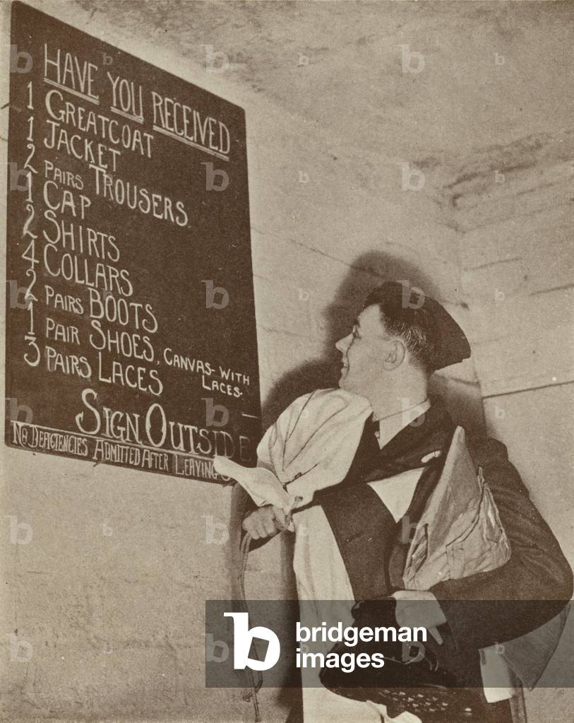 British RAF cadet checking his issue of kit (b/w photo)