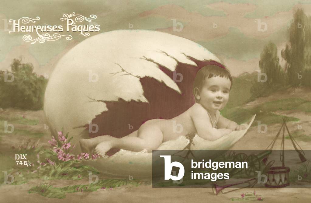 Easter card, showing baby emerging from large egg (colour photo)