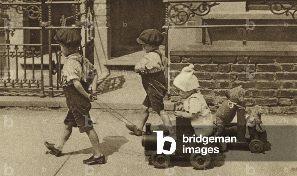The street as a playground for the London child (b/w photo)