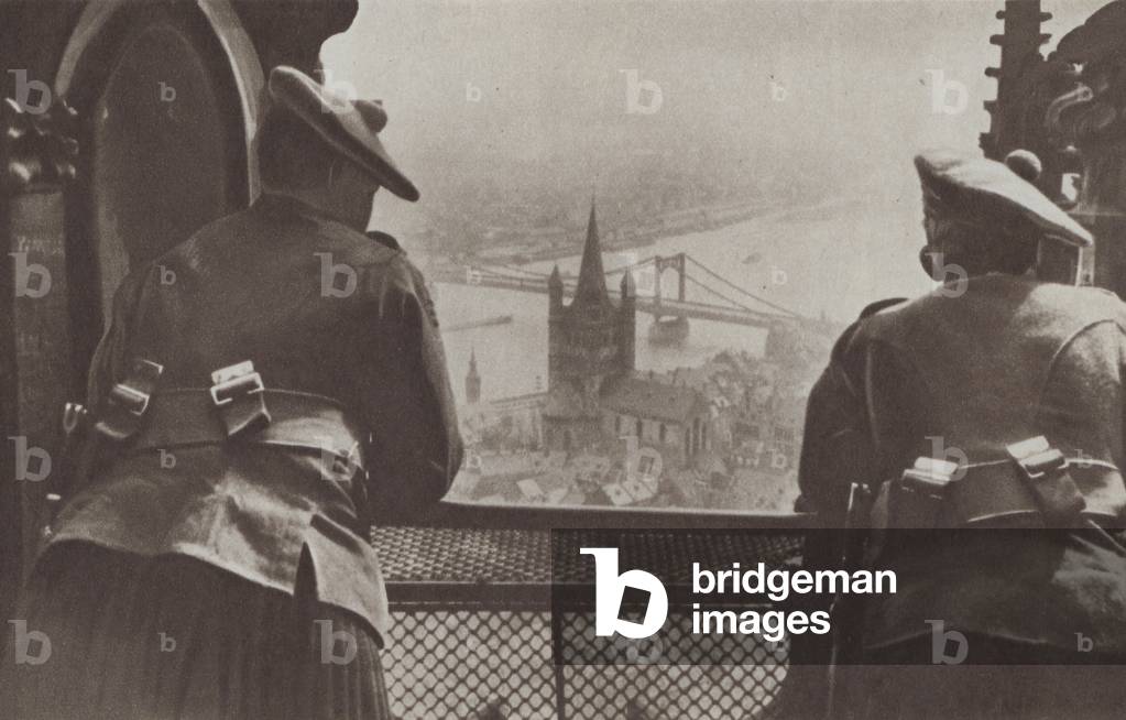 British soldiers of the army of occupation looking down on the River Rhine at Cologne, Germany, 1919 (b/w photo)