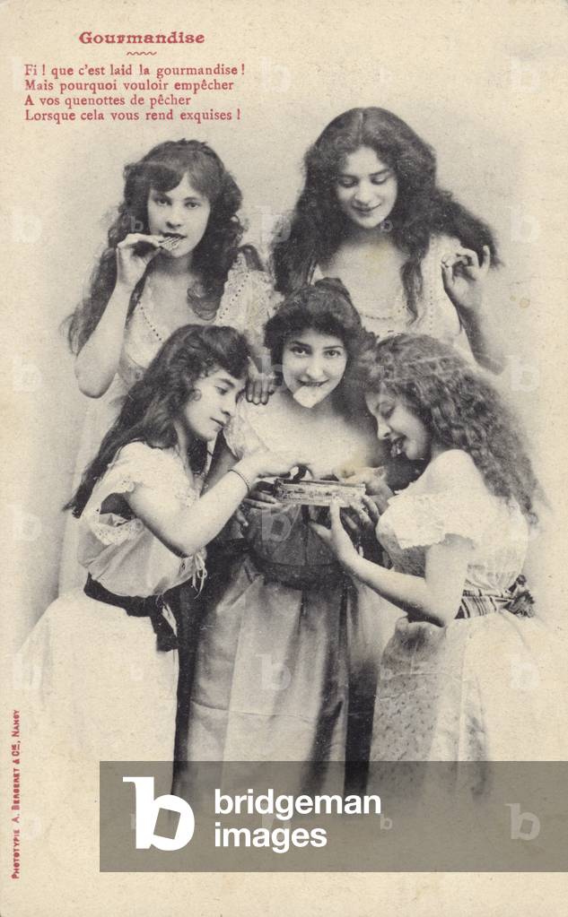 Girls eating chocolates (b/w photo)