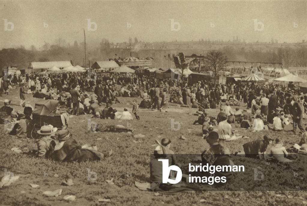 Merrymakers at one of London's bank holiday carnivals on Hampstead Heath (b/w photo)