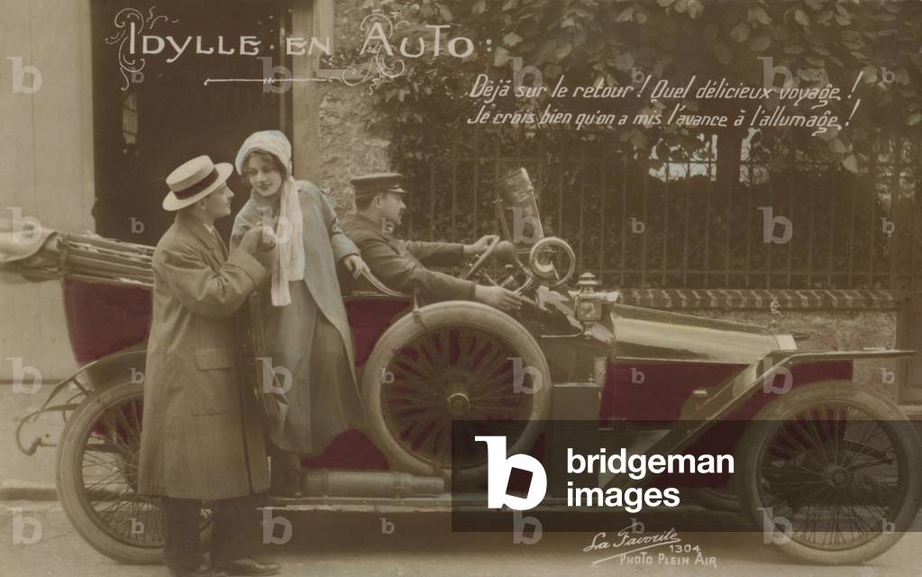 Couple with a motor car (colour photo)