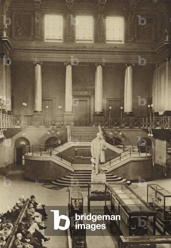 Central hall of Euston Station with train models and statue of Robert Stephenson (b/w photo)