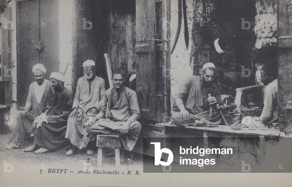 Arabian blacksmiths in the street, Egypt (b/w photo)