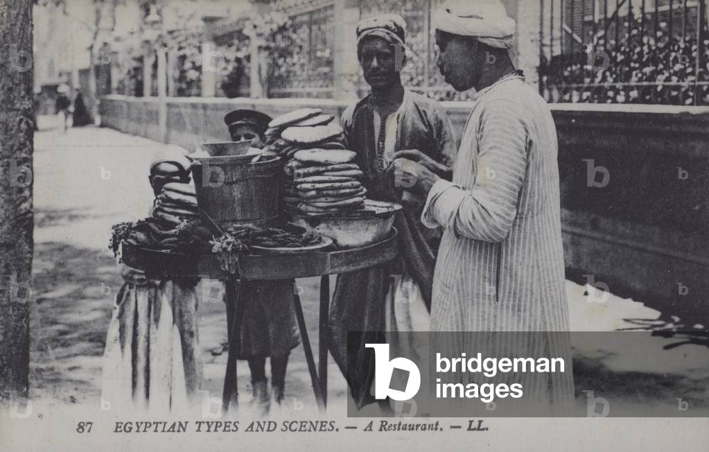Egyptian bread sellers on a street (b/w photo)