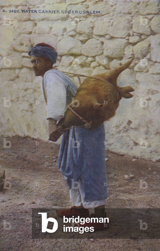 Man carrying water, Jerusalem (coloured photo)