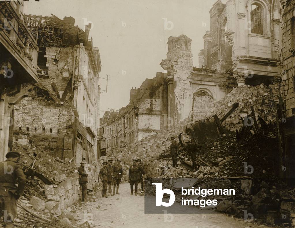 General Sir Samuel Hughes inspects the ruins brought about by German gunfire in the town of Arras (b/w photo)