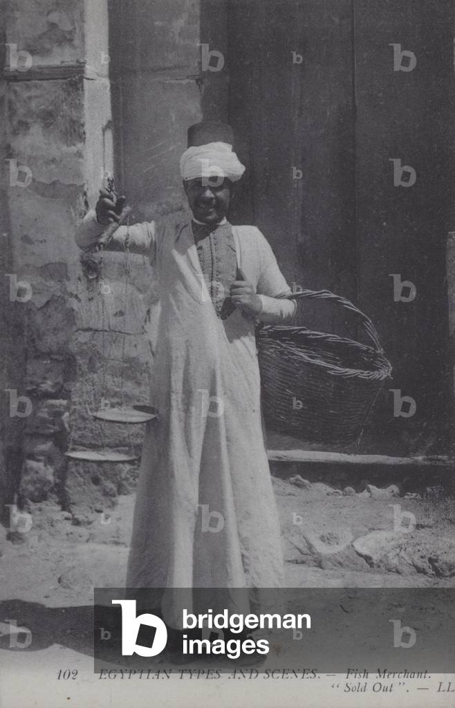 Man selling fish, Egypt (b/w photo)