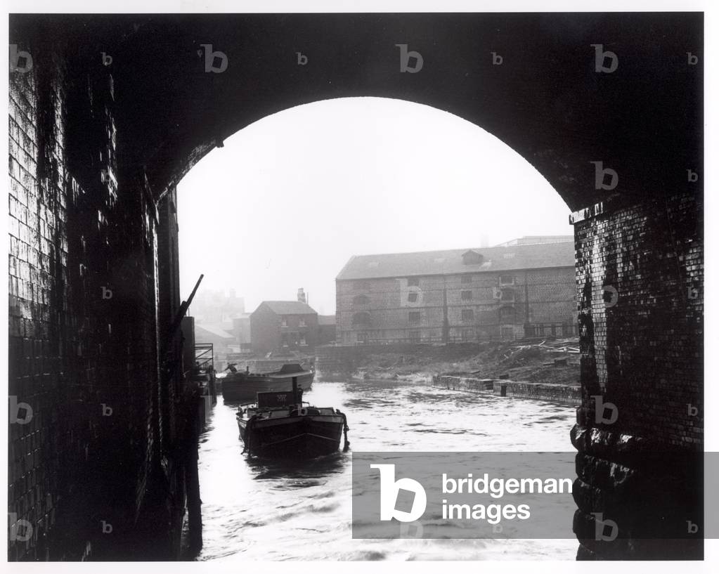 River Aire viewed from the Dark Arches, Leeds, 1951 (b/w photo)