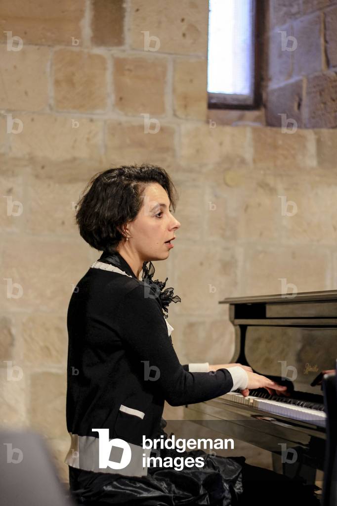 Maria Meerovitch. Russian pianist based in Antwerp, at the piano - performance in The Royal Manor House, Kouklia, Cyprus, 2013 (photo)