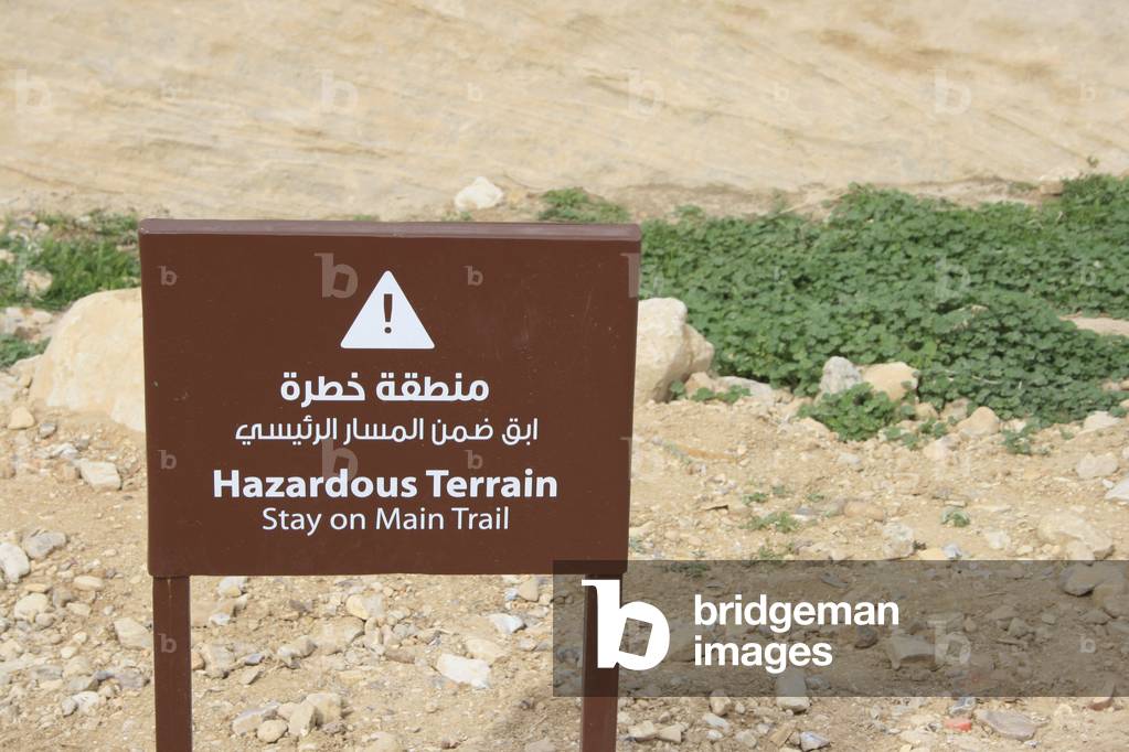 Sign reading 'Hazardous terrain'