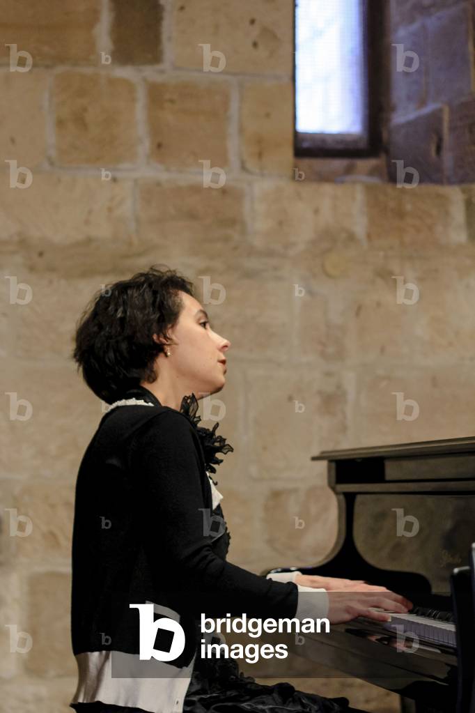 Maria Meerovitch. Russian pianist based in Antwerp, at the piano - performance in The Royal Manor House, Kouklia, Cyprus, 2013 (photo)