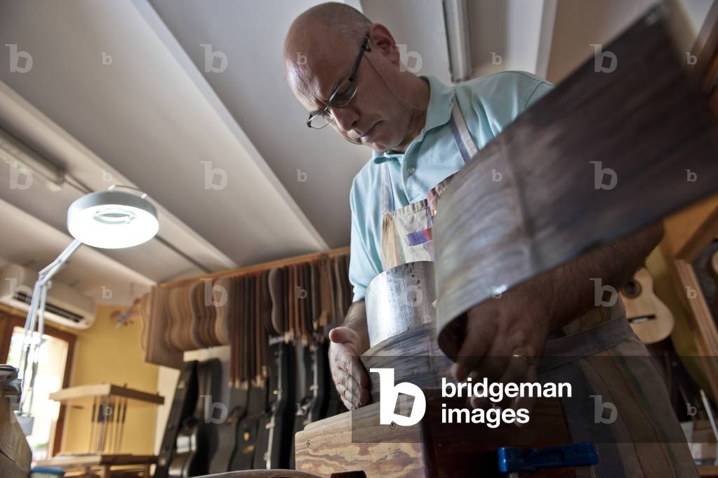 Master Luthier (Guitar-Maker)  making a classical Spanish guitar