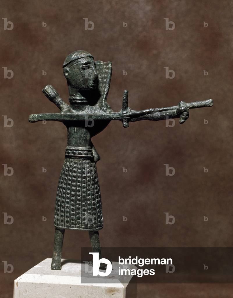 Warrior wearing an oriental skirt. 8th-7th century BC (bronze statuette)