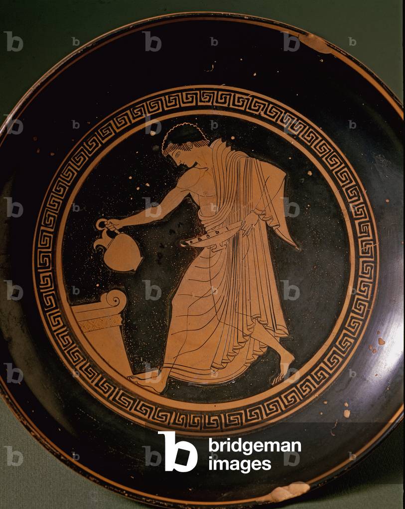 Kylix by Douris depicting a young man near an altar. 500 BC. (terracotta)