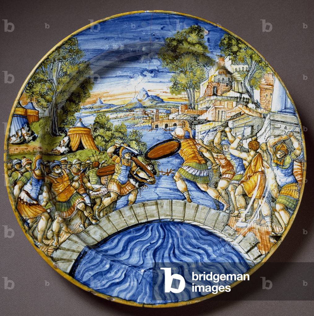 Episode of the defense of the Sublicius Bridge by the legendary Roman heros Horatius Cocles during the fighting against the Etruscan Ceramic plate produced in Urbino in the workshop Fontana, Italy. 1560 around Florence, Museo Nazionale del Bargello