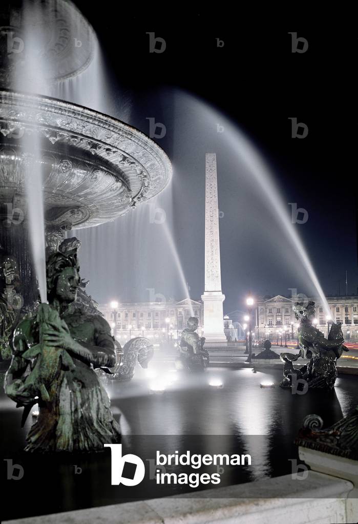 View of the fountain made by Jacques Ignace Hittorff and the obelisque of Place de la Concorde in Paris.