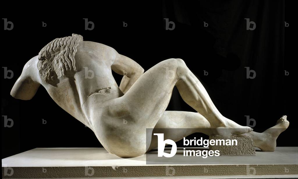 Greek Art: “” Giant”” Sculpture of the pediment of the Temple of Athena. 525 BC. Athenes, Acropolis Museum