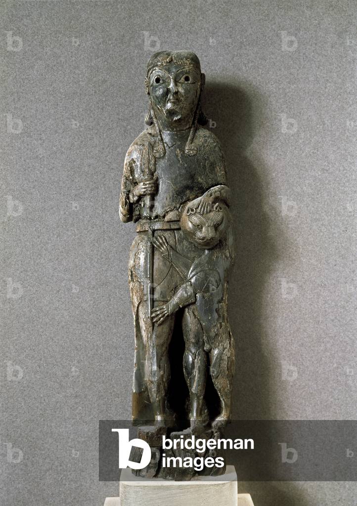 The lion tamer. 7th century BC. ( Ivory sculpture) by Greek school