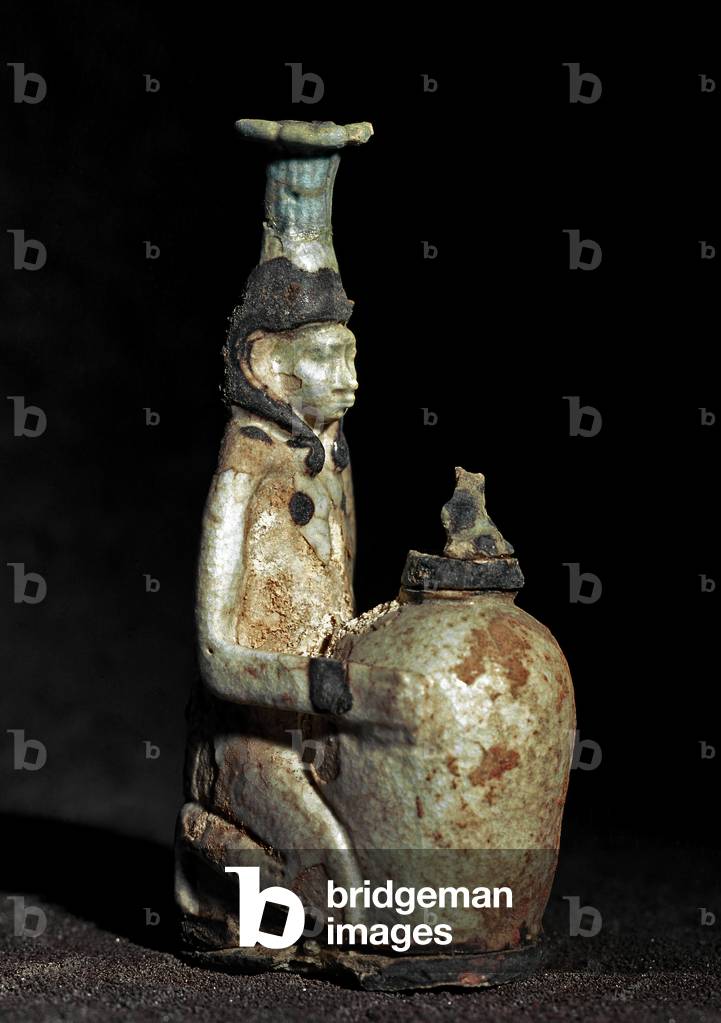 Recipient in the shape of a woman squatting. 6th century BC.