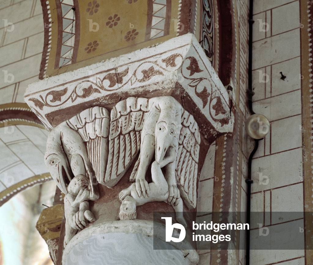 A bird eating a man, carved capital of the chancel