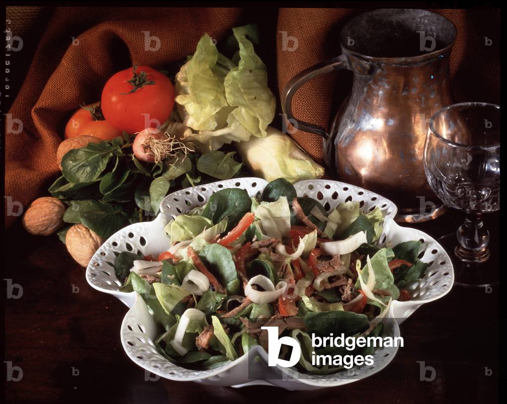 Food still life: lettuce salad and roast beef (photography)