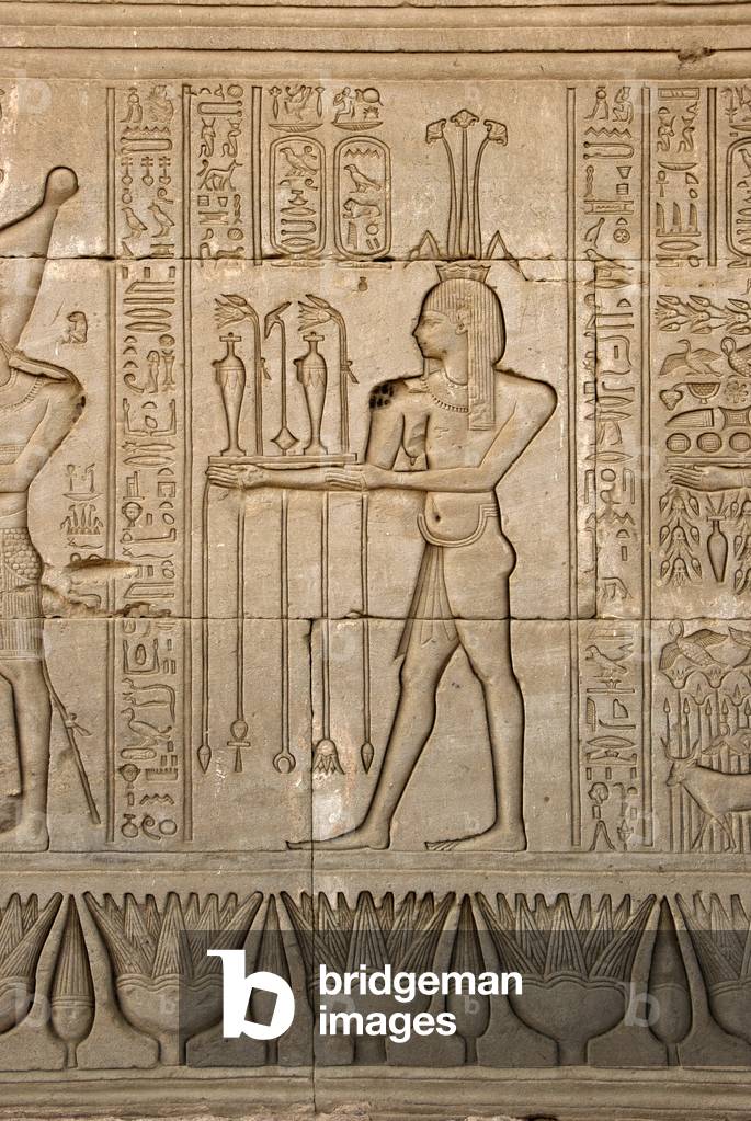 Egyptian antiquite: representation of the god of the Nile, Hapy, and hieroglyphs, Temple of Hathor, Denderah, Egypt - Egyptian civilization: the god of the Nile, Hapy, and hieroglyphs carved on the wall of Hathor Temple (or Temple of Tentyra) in Denderah, built under the reign of Pepi I (ca. 2250 BC) - Dendera Temple Complex, Egypt