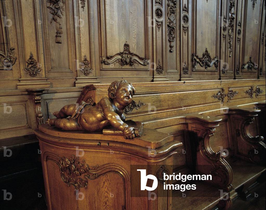 Baroque architecture: wooden stall representing an angel, attribute of the evangelist Saint Mathieu. Choir (18th century) of the Church of St. Stephen. Internal view. Marmoutier, Bas Rhin (67).